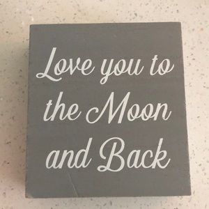 Adorable sign “love you to the moon and back “
